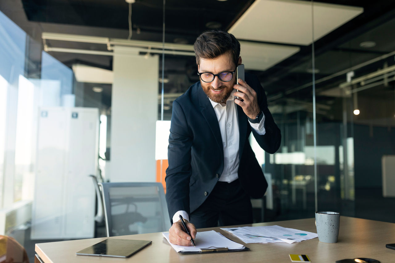 business person on the phone at a desk