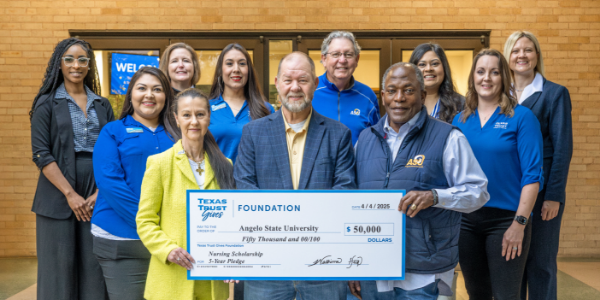 Texas Trust employees presented grant check to Angelo State University