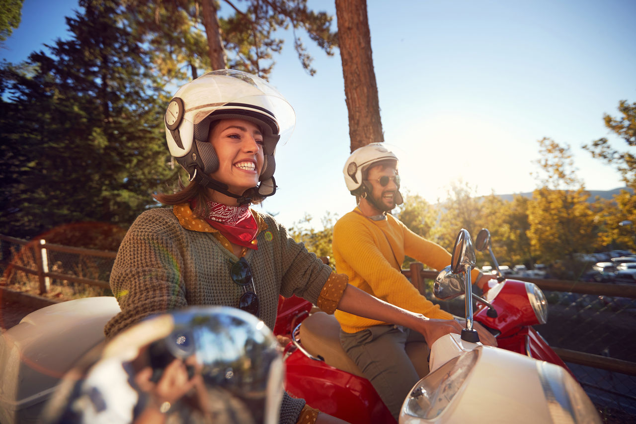 Happy couple on motobikes 