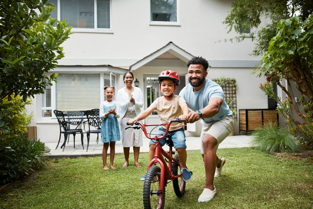 Family playing in the front yard